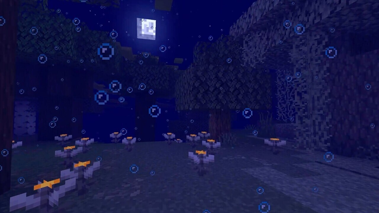 Pale garden biome that has blue fog, and bubble particles that has been modified with a data pack.