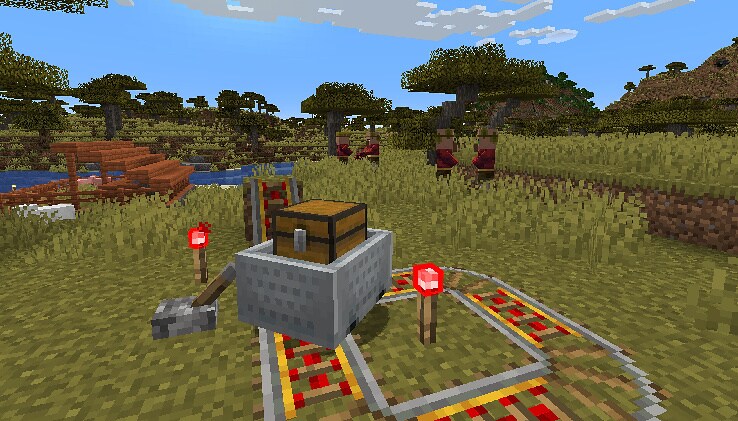 An experimental Minecart with Chest is speeding up on a powered circular railway, ready to be launched onto the distant track across the water.