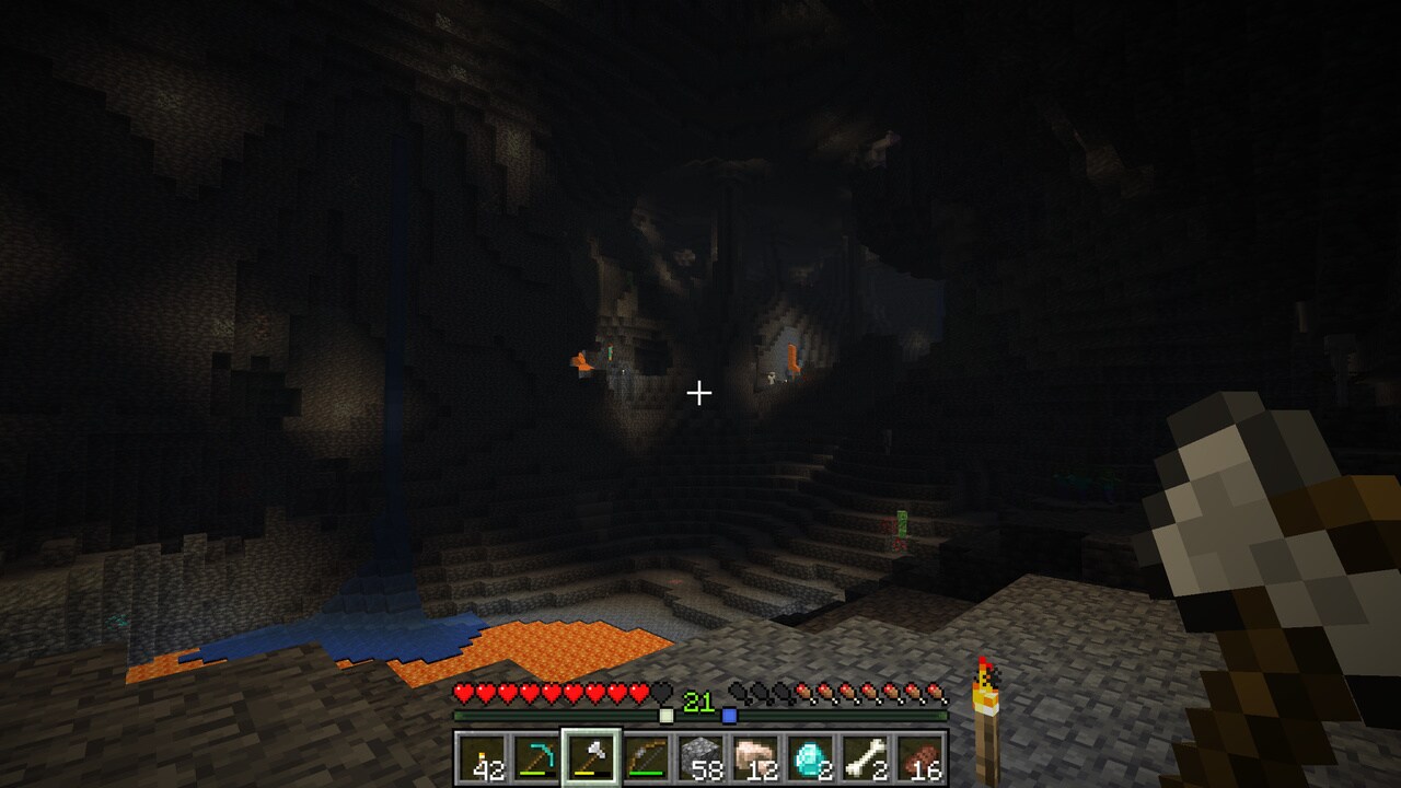 Player using the locator bar to find their friends in a large cave with skeletons onlooking.