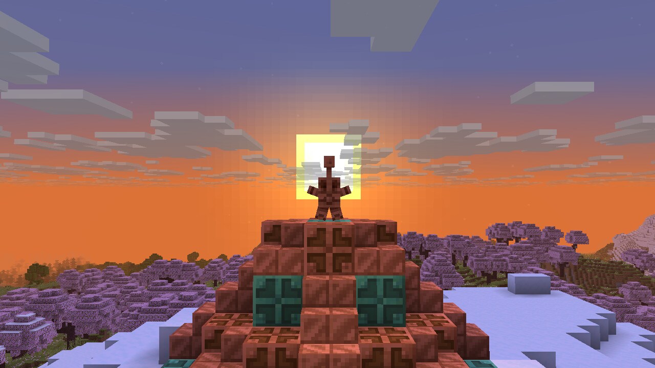 A Copper Statue, doing its signature &#34star&#34 pose, can be seen on top of a copper pedestal.