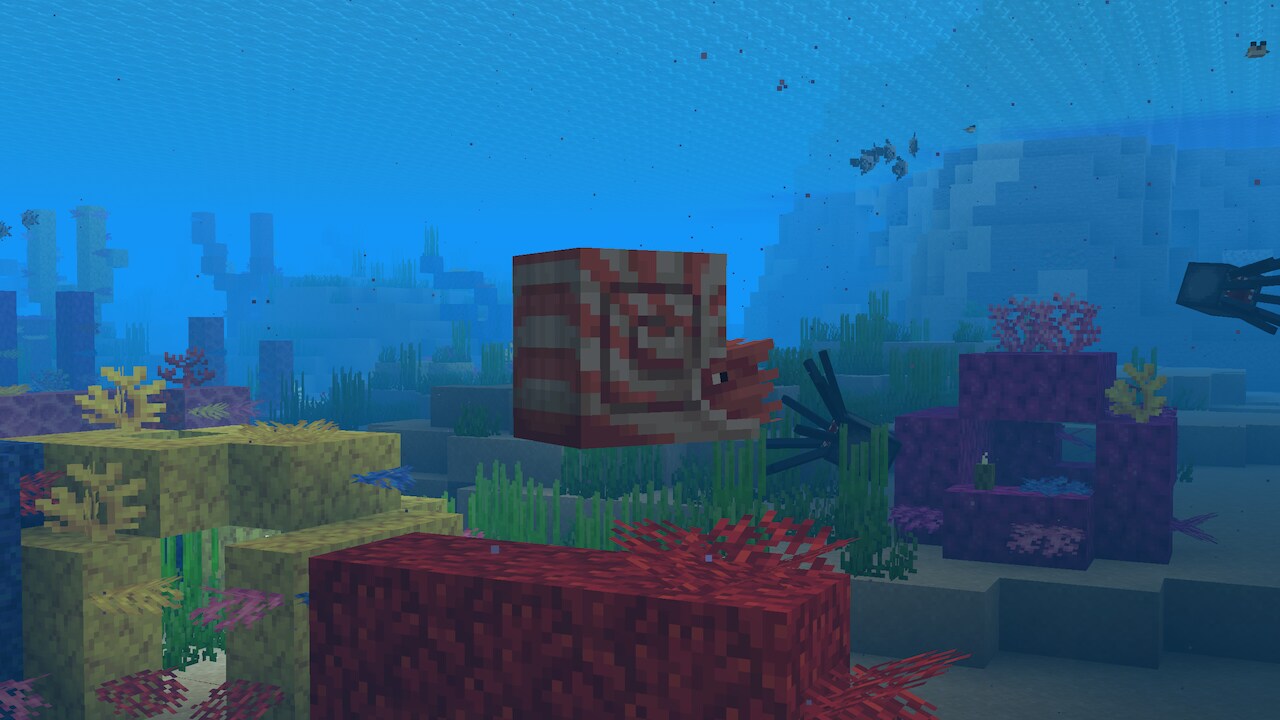 Nautilus swimming above coral reef with fish and squid in the background.